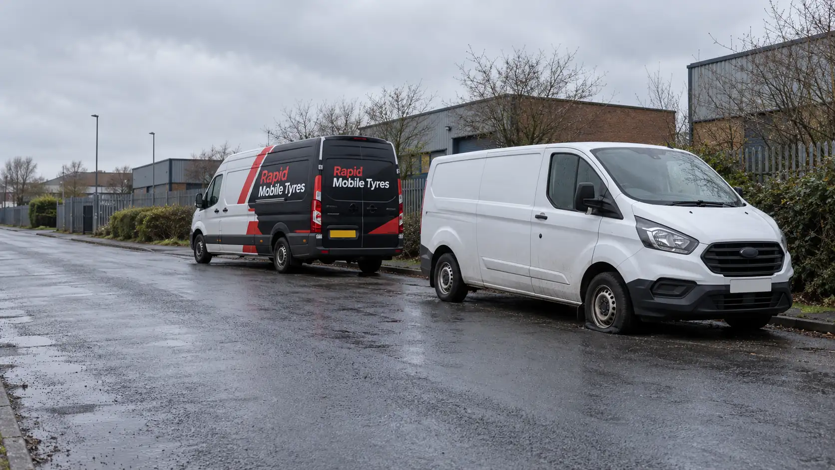 A Rapid Mobile Tyres service van attending a van with a flat tyre
